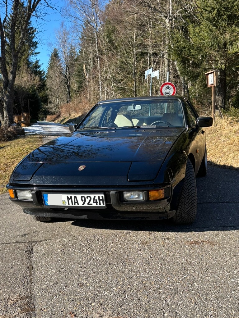 Black Porsche 924 on a forest road